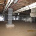 Right – Foil-faced insulation was added after the crawlspace was dried and sealed by diverting water runoff, sealing off crawlspace windows and vents, and adding sump pumps and exhaust fan ventilation