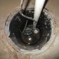 Right – A sump pump with a perforated sump pit was installed in the crawlspace slab to reduce water accumulation under the slab