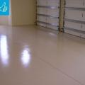 Right – The slab is coated with two coats of epoxy paint to minimize moisture transfer through the slab from the ground. 