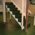 Epoxy paint is installed to provide a moisture control layer on the surface of an existing basement slab
