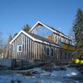 This farmhouse was retrofit by removing the existing siding and adding taped insulated sheathing and battens before installing new siding