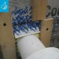 Right - This duct penetration is properly flashed and integrated with the taped, foil-faced foam sheathing layer, which serves as the air and water barrier