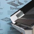 Step 3. Place the first shingle and the next section of sidewall flashing over upper edge of diverter
