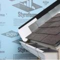 Step and kickout flashing should be installed at all roof-wall intersections to protect the wall and divert rainwater runoff into a gutter.