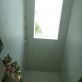 Peeling paint indicates water infiltration around a skylight