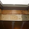 Water stains on the framing indicate water infiltration at the skylight