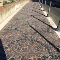 Pavers, gravel, stone, and other permeable surfaces allow rainwater some opportunity to drain minimizing storm water runoff.