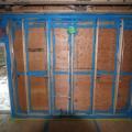 Sprayer-applied sealant seals every seam in the sheathing and framing of this double-walled home. 