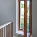 Ultra-efficient, R-9, triple-pane windows have insulated wood frames, argon gas between the panes, and low-emissivity coatings to slow heat transfer.