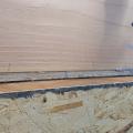 Right - Mastic is being installed to air seal the wood-to-wood joints in this wall.