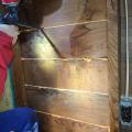 Right - Wood board sheathing seams are being sealed with low-expanding spray foam.