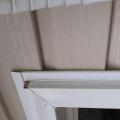 Wrong - Vinyl siding in incorrectly installed under not over door trim and door trim channel pieces are missing.