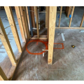 Wrong: Not enough space was left in the floorplans for both the heat pump water heater and a duct elbow to be attached to the right side of the water heater (the orange circle outlines the tank; the rectangle shows the space needed for the duct)