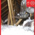 Wrong: Ducts are not laid across the lower truss cords or ceiling, but are hung from the rafters by straps. As a result, ductwork is not buried