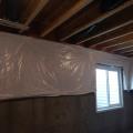 Wrong - The basement blanket insulation is loosely attached to the interior of the basement wall, does not cover the entire wall, is not sealed at the edges, and is not installed over rigid foam that covers the entire surface of the foundation walls.