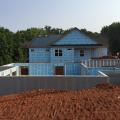 The daylight basement walls are made of concrete walls with integrated rigid foam and steel-faced concrete studs.