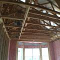 The OSB roof decking product comes with an adhered radiant foil barrier which helps to prevent heat transfer in or out of the vented attic, while R-13 unfaced fiberglass fills the advanced-framed 2x6 walls.