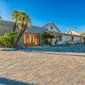 The builder took several steps to make this southern California home fire resistant, including constructing with metal roofing, unvented soffits, and impact-resistant glass, and landscaping with rock, sand, and pavers. 