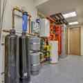 This home’s domestic hot water is provided by three systems: solar water heating panels, a heat pump water heater, and an air-to-water heat pump, which also provides hot water to a fan coil. 