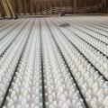 Hot water for the home’s radiant floor heating system comes from roof-mounted solar thermal panels and an air-to-water heat pump provide. 