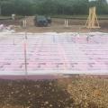The home’s slab-on-grade foundation is wrapped in a blanket of rigid foam extending completely under the slab and along the edges.
