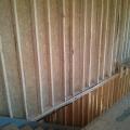 The builder staggers 2x4 studs on 2x6 top and bottom plates which provides gaps to fill in insulation around the framing for a continuous blanket of insulation.