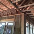 Baffles will keep insulation out of the soffit vents and wind out of the insulation in this vented attic.
