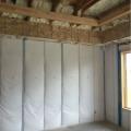 The rim joists and top plates are air sealed and insulated with open-cell spray foam while the walls are filled with blown fiberglass.