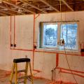 Wiring runs are covered with canned spray foam to maintain the continuous foam layer that covers the inside and outside of these ICF block walls.