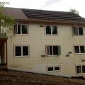 Seams in the ICF block are sealed so the EPS foam surface can serve as the drainage plane; no house wrap is needed. 