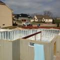 The basement is constructed with precast concrete walls lined with R-21.3 foil-faced rigid foam while an R-10 layer of XPS rigid foam covers the ground under the slab.