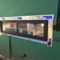 Tape flashing around windows helps to keep moisture out of the framed walls.