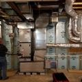 Right - The precast insulated concrete walls of the basement provide a conditioned space for the high-efficiency (18 SEER, 9.5 HSPF) air-source heat pump, with its variable-speed fan, five-stage compressor, and MERV 11 filter.