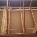In the attic, all of the top plate seams are sealed with canned spray foam before covering the ceiling deck with blown fiberglass.