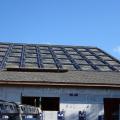 The photovoltaic panels sit in a waterproof plastic tray that was installed directly on the roofing underlayment, then surrounded with roofing shingles. 