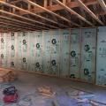 Right - The poured concrete basement walls are insulated along the inside with 2.5 inches of extruded polystyrene insulation.