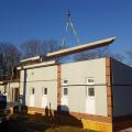 The walls and floors of this modular home were constructed in a factory and are brought to the site already insulated and ready for quick assembly.