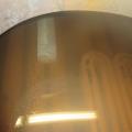 An anode bar (upper grey bar) is installed in a steel boiler