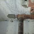 Do not install a main vent on top of a drip leg where water spitting is likely to occur, which can damage the vent