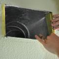 Duct boot is air sealed to ceiling by covering the seam with fiberglass mesh tape and mastic