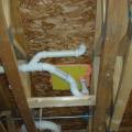 Plumbing penetrations through the subfloor are air-sealed.