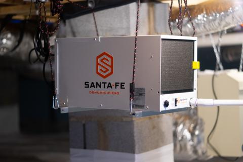 Right – A dehumidifier keeps the sealed crawlspace dry.