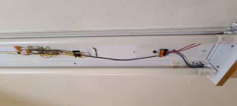 The electronic ballast has been removed from this linear fluorescent fixture and the wiring attached to the ends of the fixture before installing Type B linear LEDs