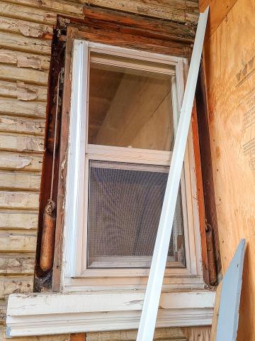 The exterior trim was removed around this window revealing the weight pockets  