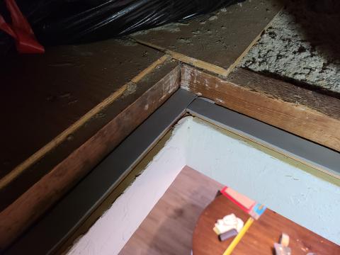 Weatherstripping has been installed along the framing of this attic access panel to air seal the opening.