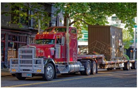 This fully packaged/skid-mounted central heat pump water heating system was shipped to the building on a truck and craned into location 