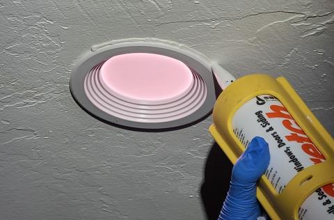 Caulk around recessed can and new LED retrofit ceiling light kits to complete the air seal.