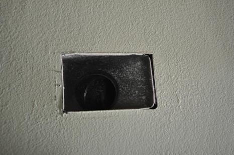 The gaps between the sheet metal of the duct boot and the drywall are clearly visible in this image.