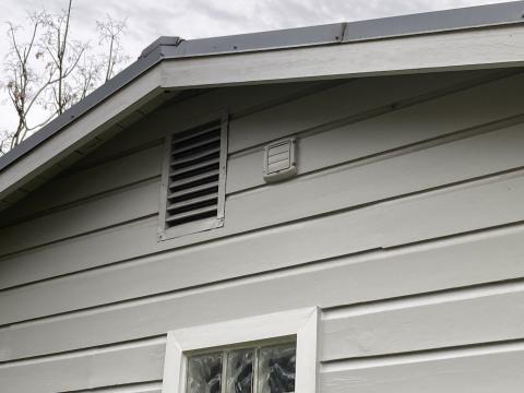 This exterior vent has a louvered flap that should close fully when the exhaust fan is turned off