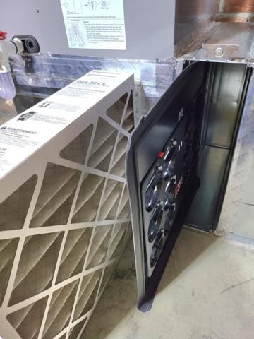 A flow grid is inserted into the filter grille/slot to directly measure airflow.